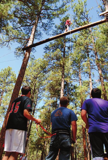 Leadership Academy participants on a ropes course