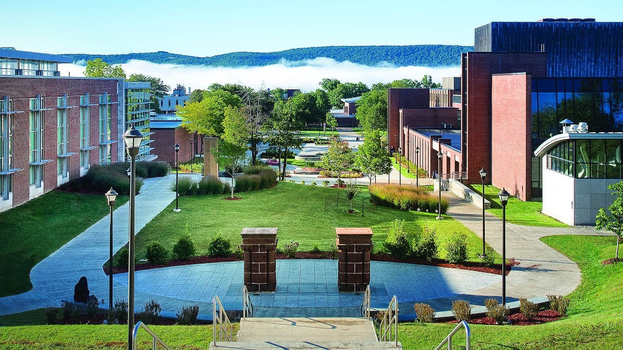 Walkway and lawn between buildings on the SUNY Oneonta campus.